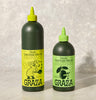Two squeeze bottles of Graza Extra Virgin Olive Oil